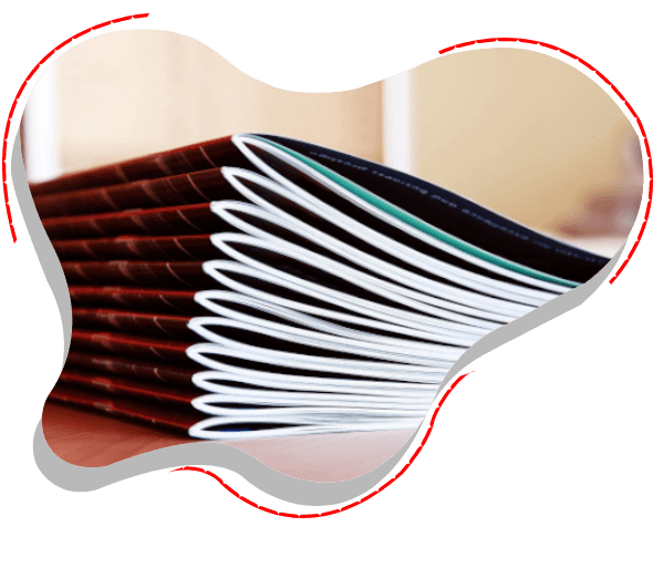 A stack of books on top of a table.