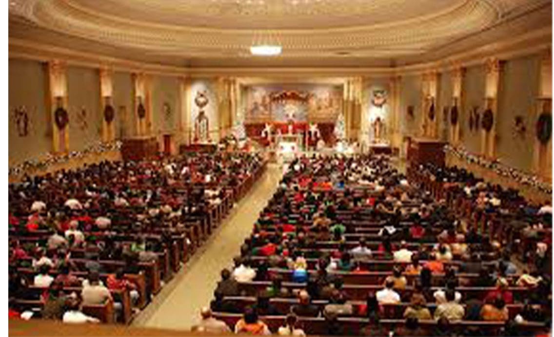 A large church with many people sitting in the church programs (4 Pages).